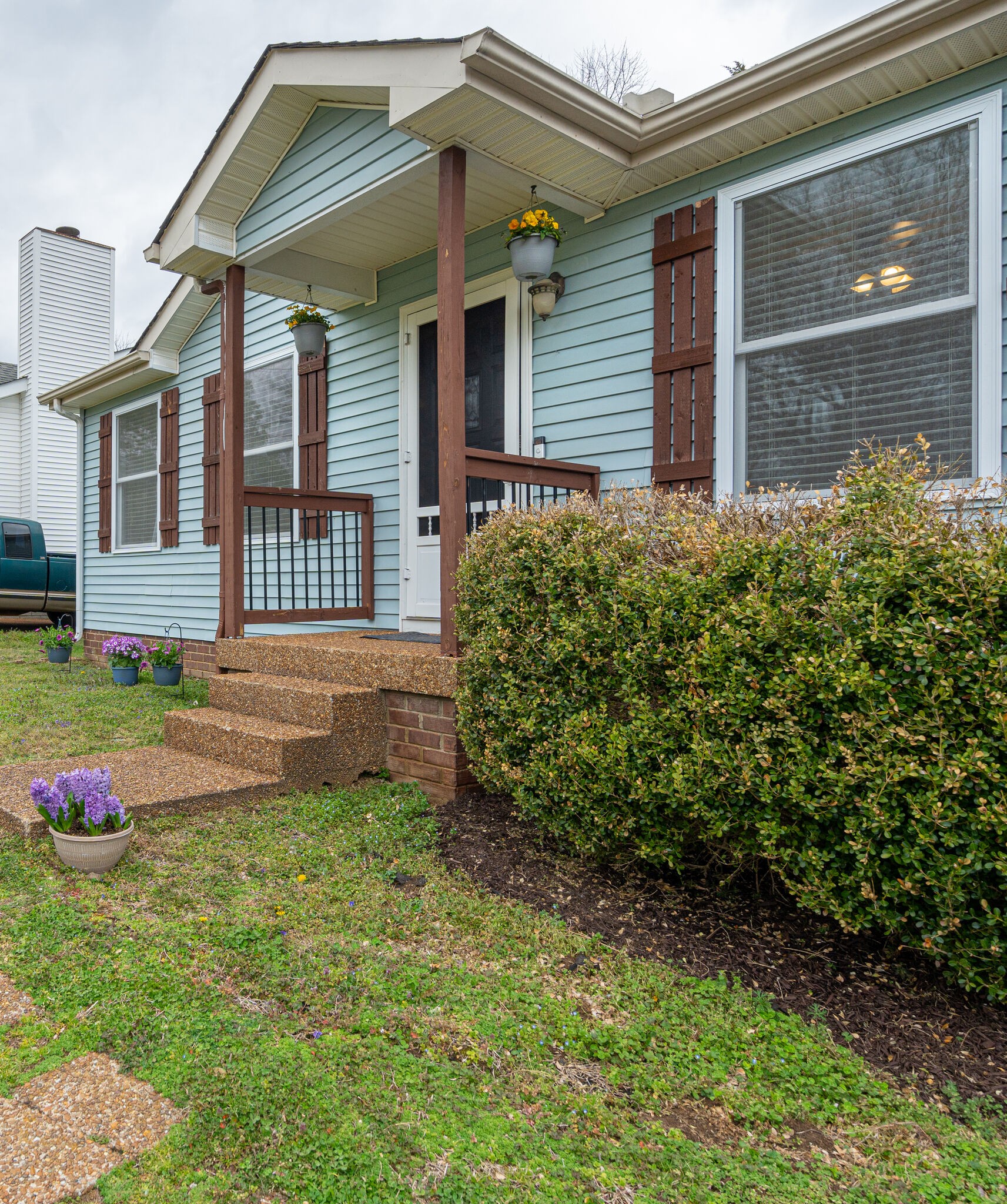 1453 Ocoee Trail Madison, TN 37115 - Photo 4 of 25 a front view of a house with garden