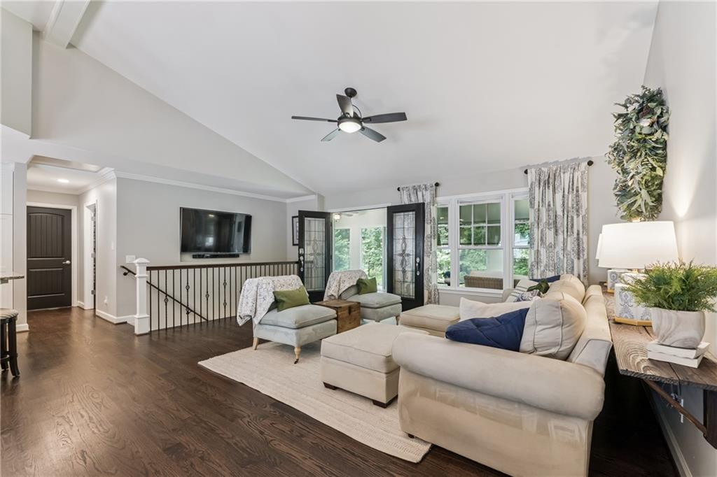 3701 Shallowford Road Marietta, GA 30062 - Photo 20 of 49 a living room with furniture a ceiling fan and a flat screen tv