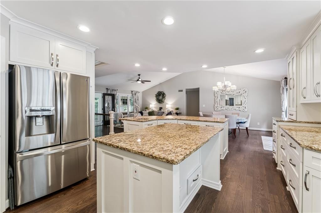 3701 Shallowford Road Marietta, GA 30062 - Photo 22 of 49 a kitchen with stainless steel appliances granite countertop a refrigerator a sink and a stove