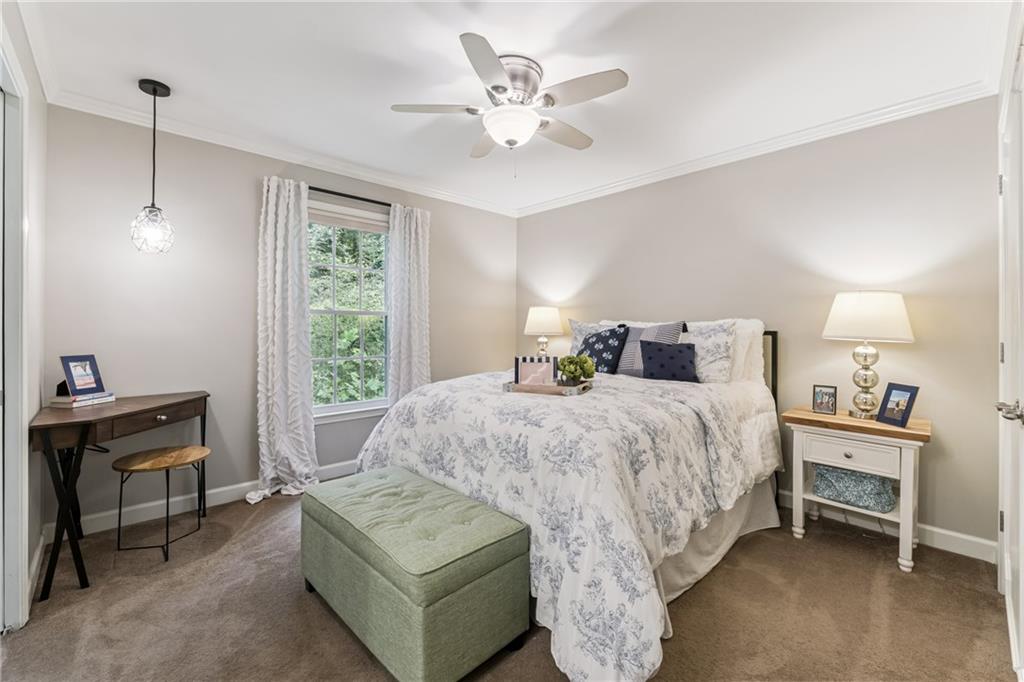 3701 Shallowford Road Marietta, GA 30062 - Photo 30 of 49 a bedroom with a bed and a desk