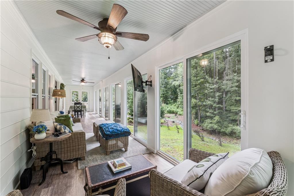 3701 Shallowford Road Marietta, GA 30062 - Photo 33 of 49 a living room with furniture and a floor to ceiling window