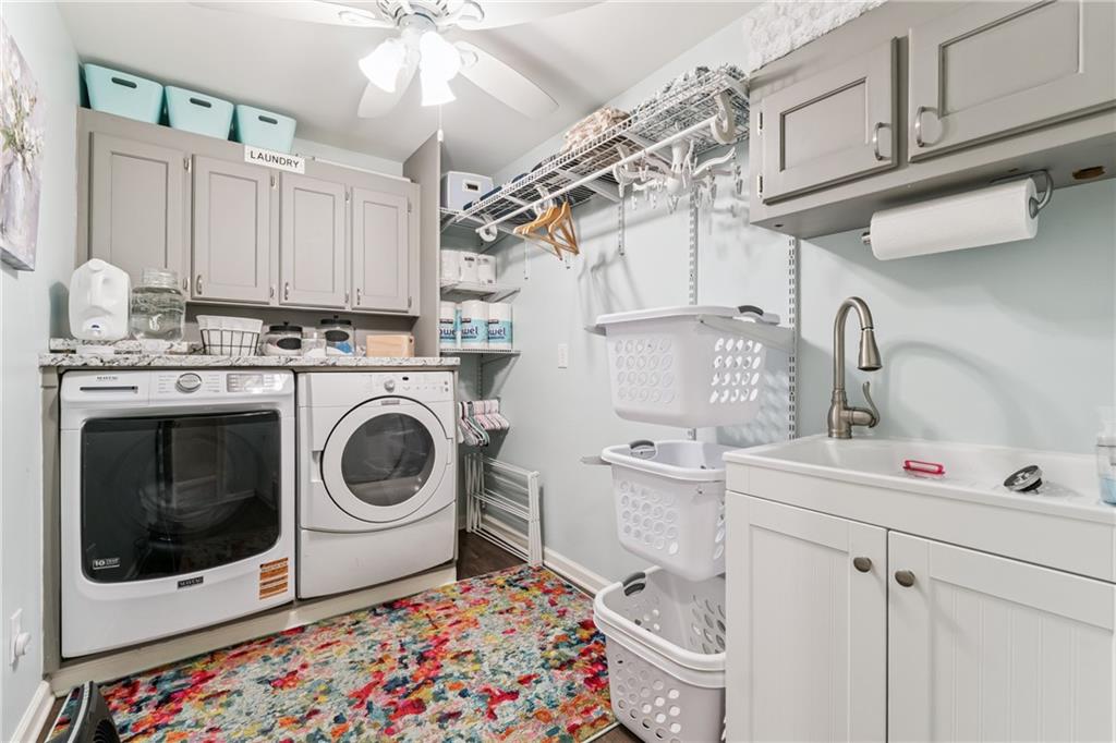 3701 Shallowford Road Marietta, GA 30062 - Photo 39 of 49 a utility room with sink dryer and washer