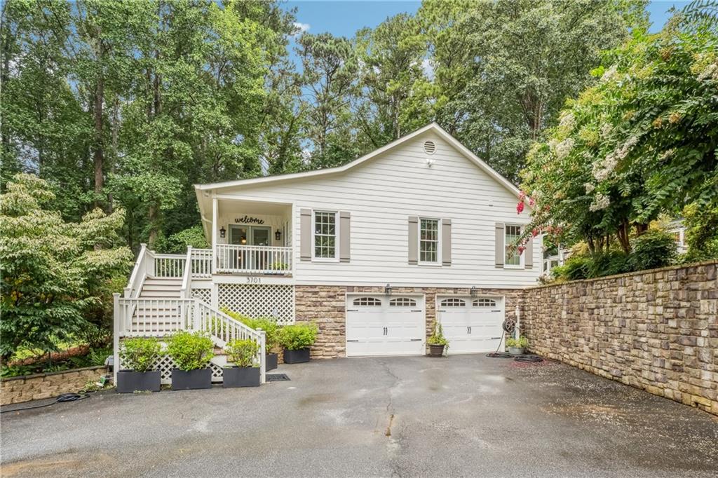 3701 Shallowford Road Marietta, GA 30062 - Photo 44 of 49 a front view of a house with a garage