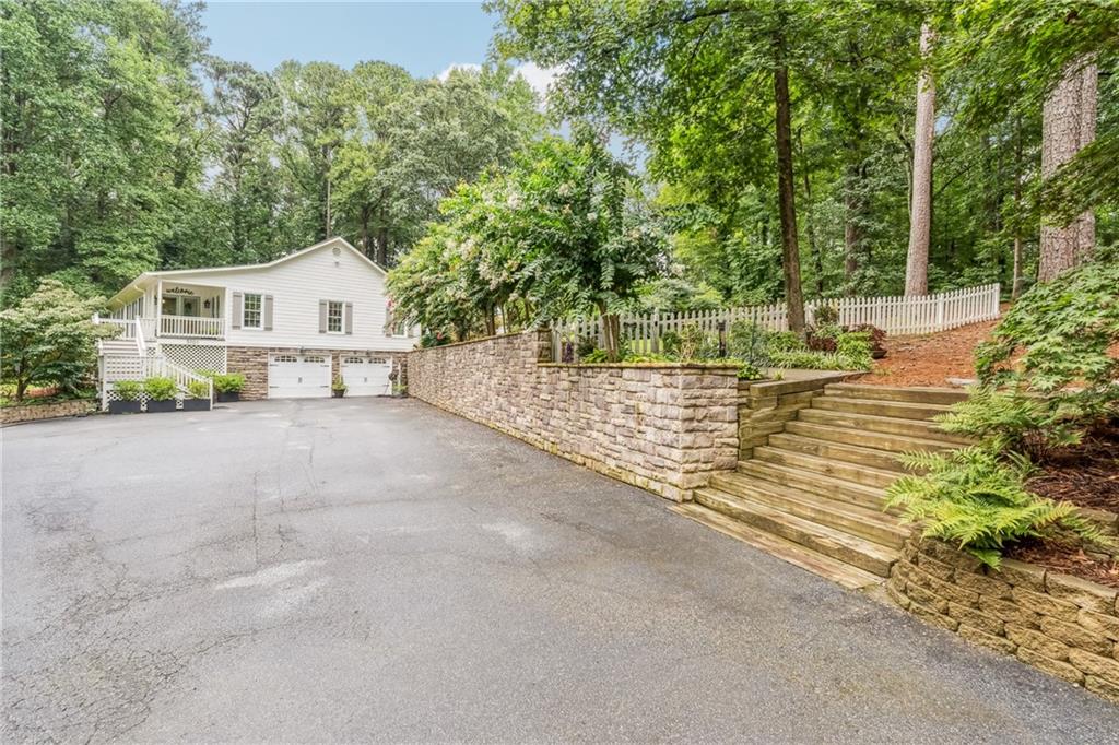 3701 Shallowford Road Marietta, GA 30062 - Photo 45 of 49 a view of a house with a outdoor space