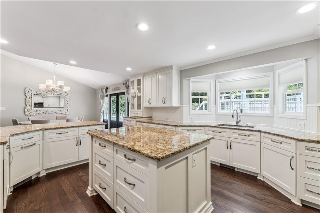 3701 Shallowford Road Marietta, GA 30062 - Photo 7 of 49 a kitchen with granite countertop sink stove and center island