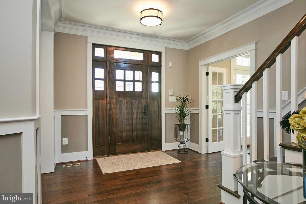 1871 Beulah Road Vienna, VA 22182 - Photo 2 of 30 a view of an entryway with wooden floor and staircase