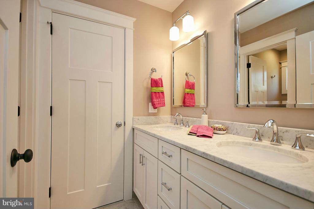 1871 Beulah Road Vienna, VA 22182 - Photo 19 of 30 a bathroom with a sink and a mirror