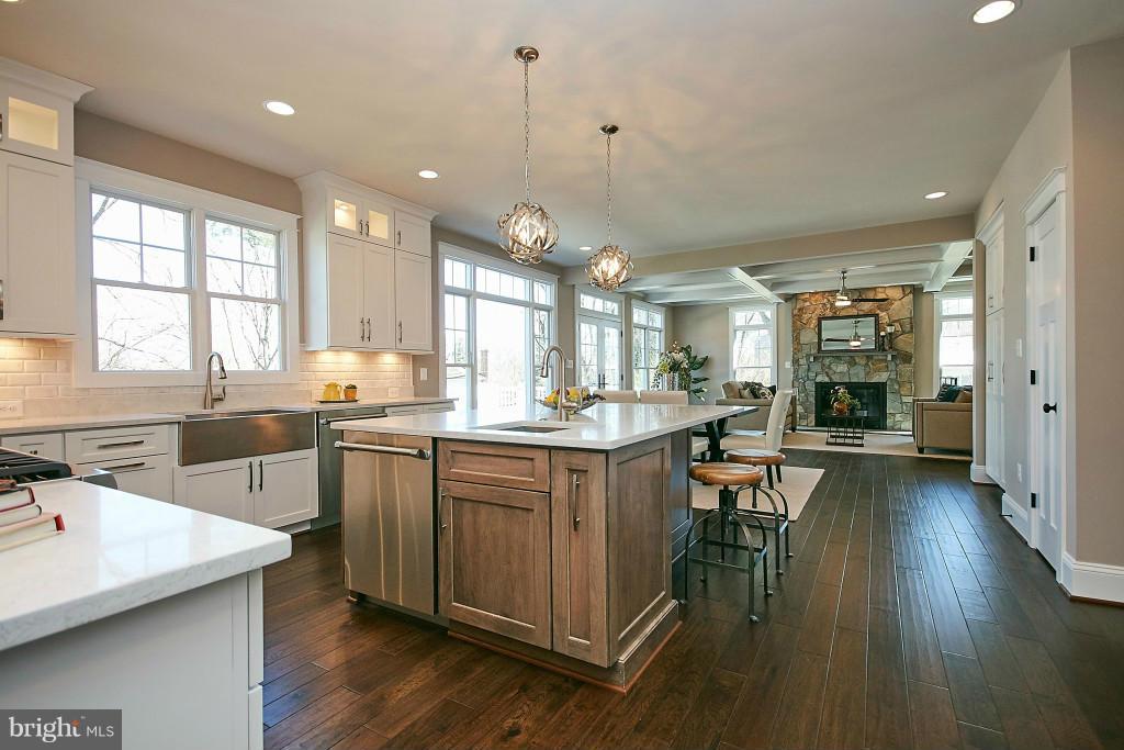 1871 Beulah Road Vienna, VA 22182 - Photo 7 of 30 a large kitchen with lots of counter space a sink appliances and cabinets