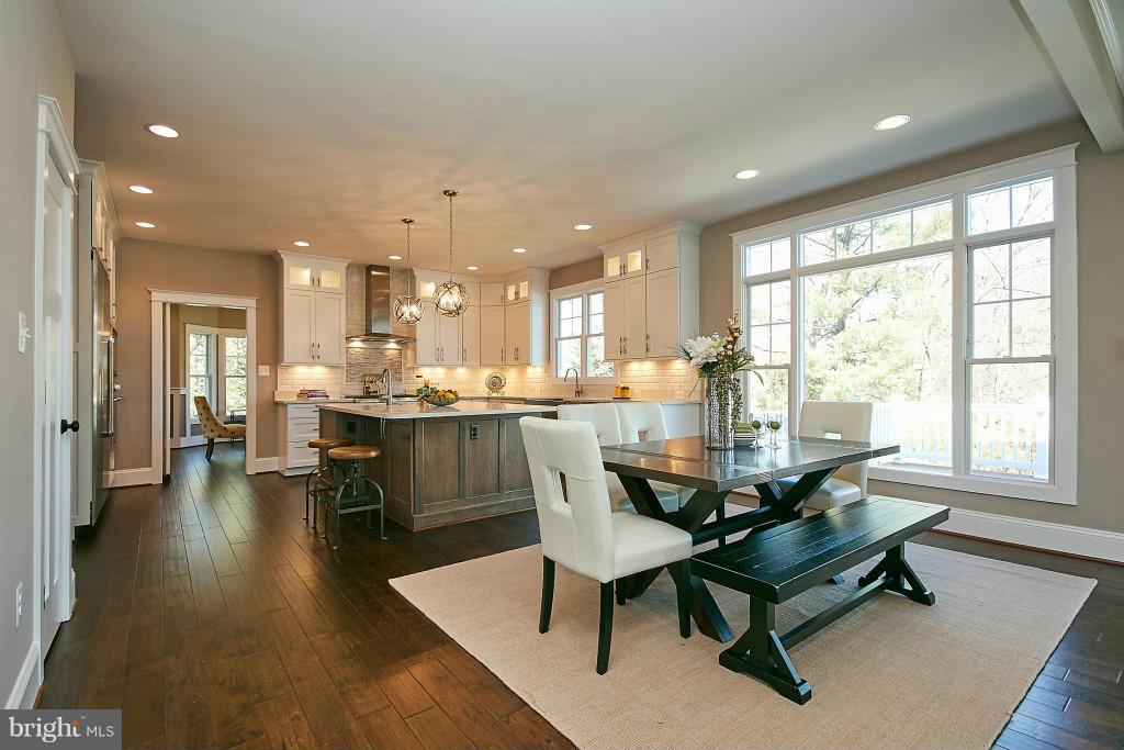 1871 Beulah Road Vienna, VA 22182 - Photo 8 of 30 a dining room with furniture and a floor to ceiling window