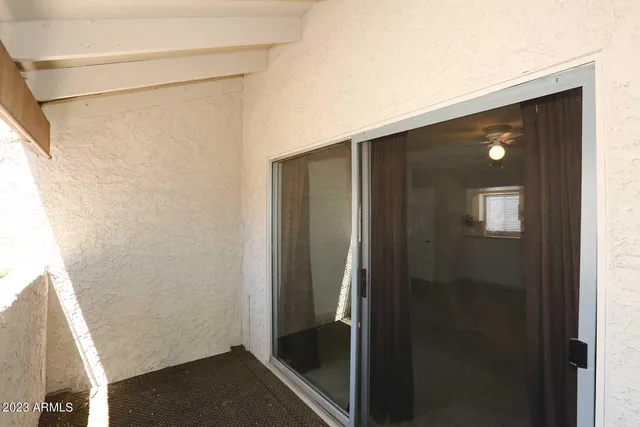 a bathroom with a shower and a sink