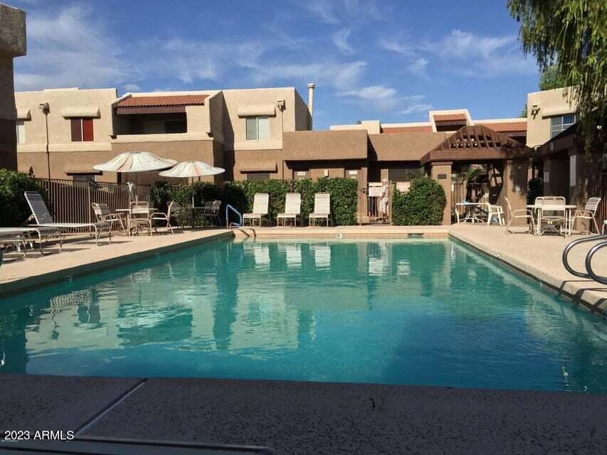 4554 East Paradise Village Parkway North, Unit 259 Phoenix, AZ 85032 - Photo 26 of 30 a view of a house with a yard