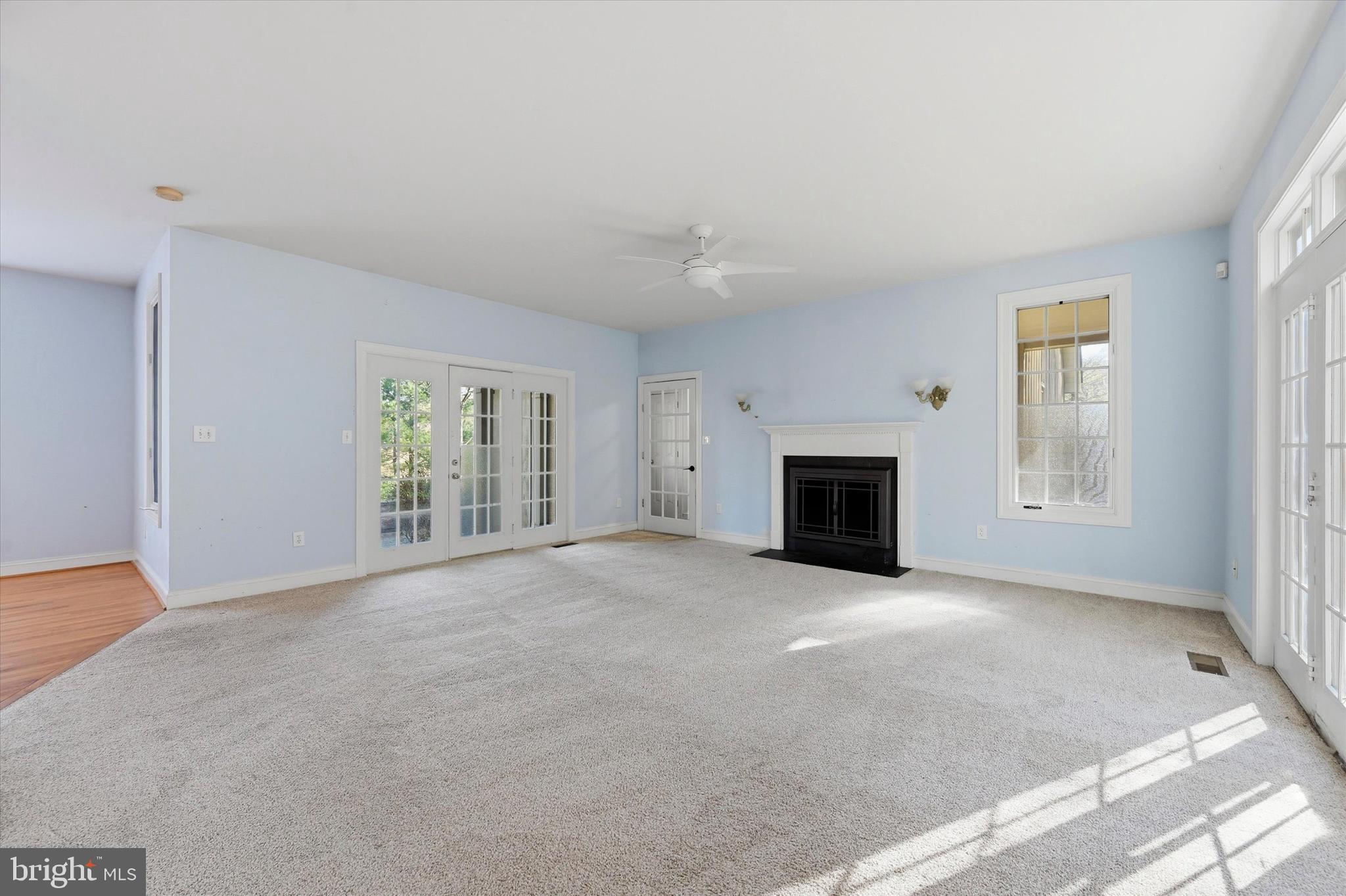 2 Timber Mill Lane Landenberg, PA 19350 - Photo 11 of 32 an empty room with windows and fireplace