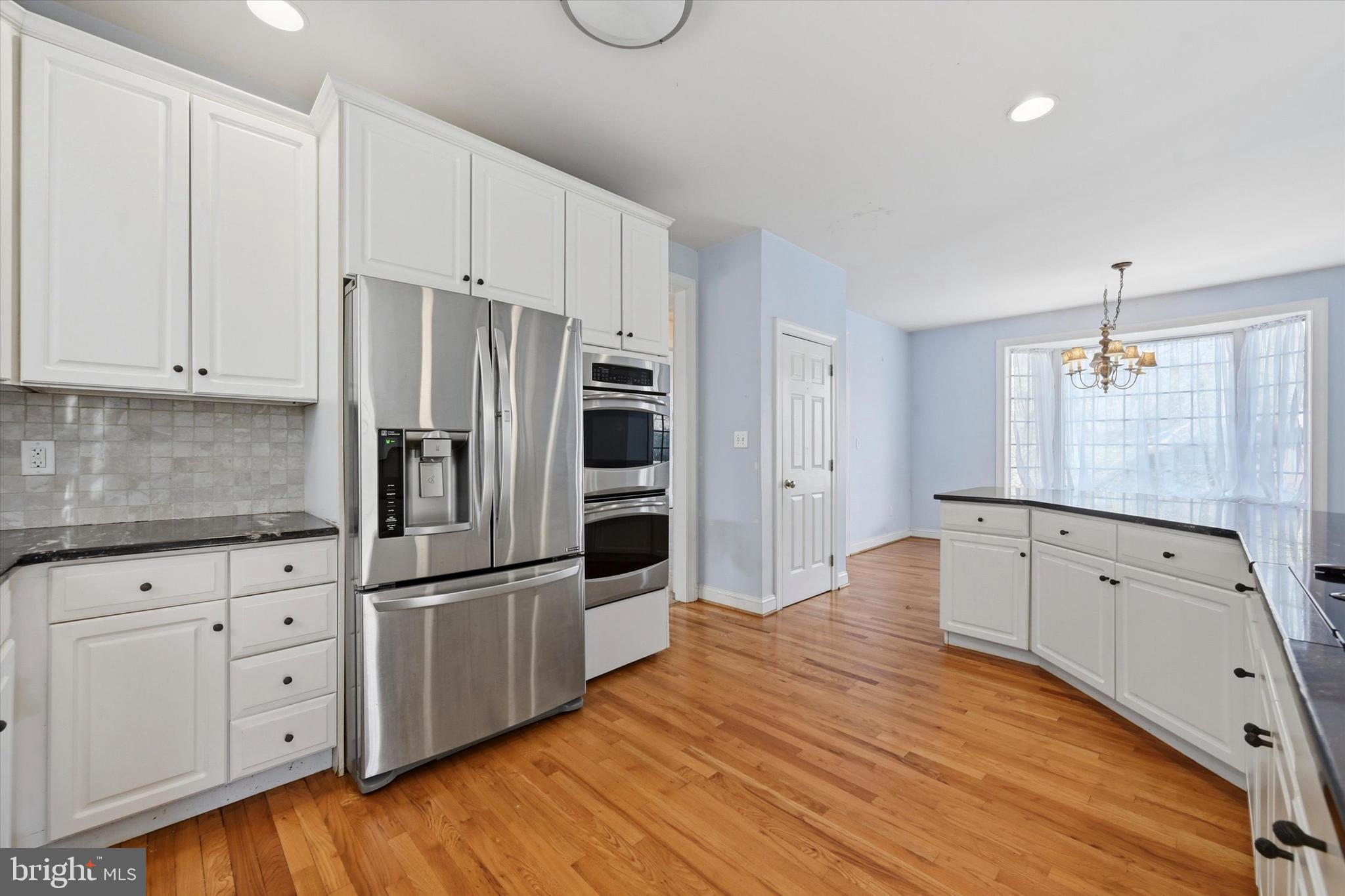 2 Timber Mill Lane Landenberg, PA 19350 - Photo 12 of 32 a kitchen with granite countertop white cabinets and stainless steel appliances