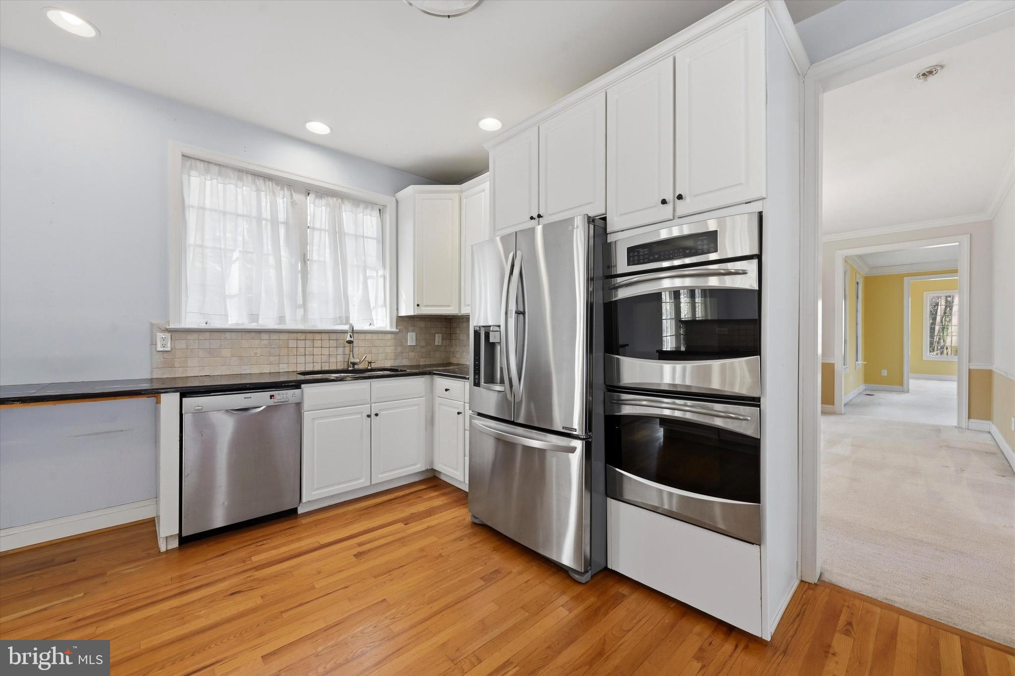 2 Timber Mill Lane Landenberg, PA 19350 - Photo 14 of 32 a kitchen with granite countertop white cabinets and stainless steel appliances
