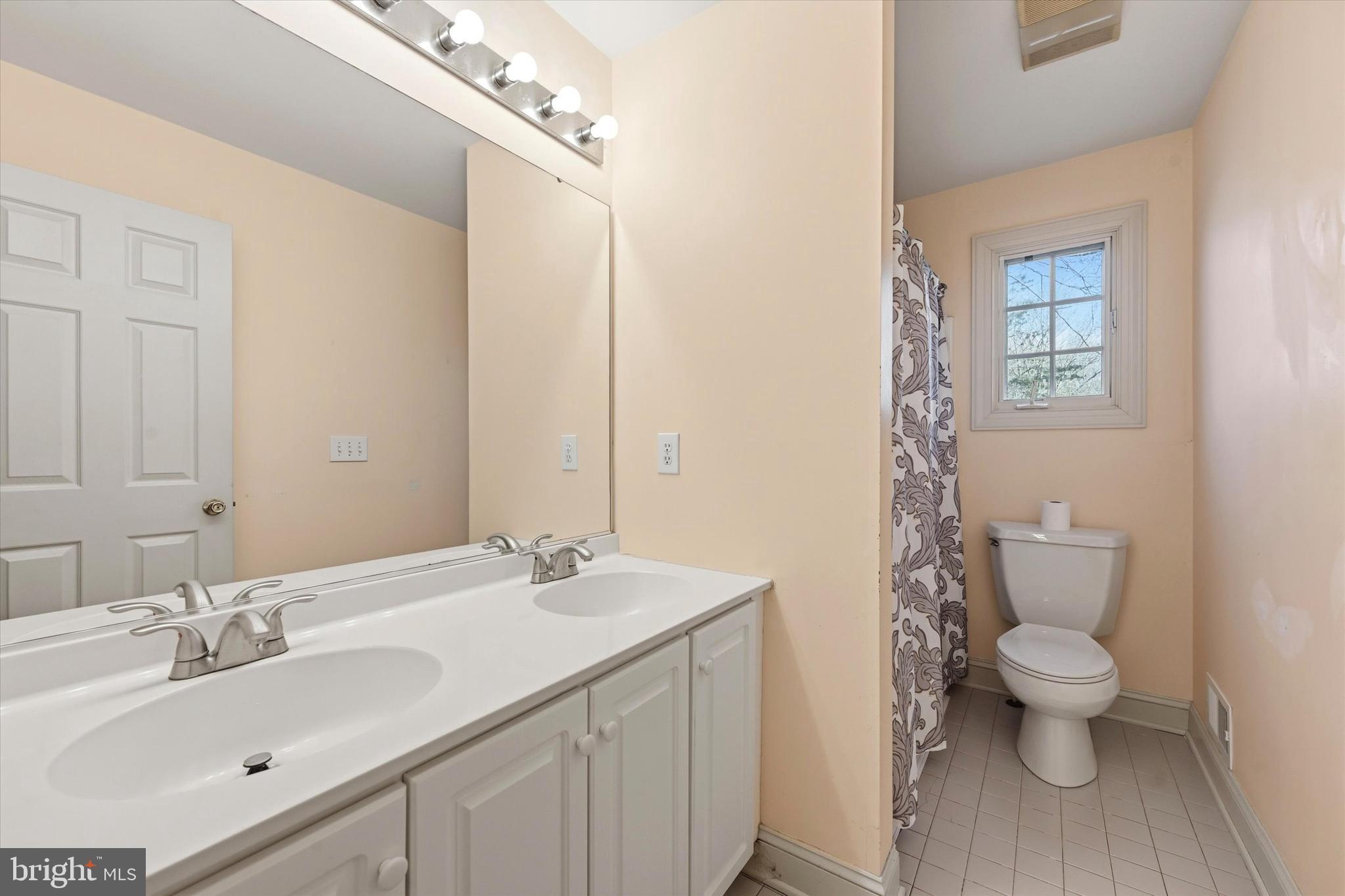 2 Timber Mill Lane Landenberg, PA 19350 - Photo 20 of 32 a bathroom with a sink toilet and shower