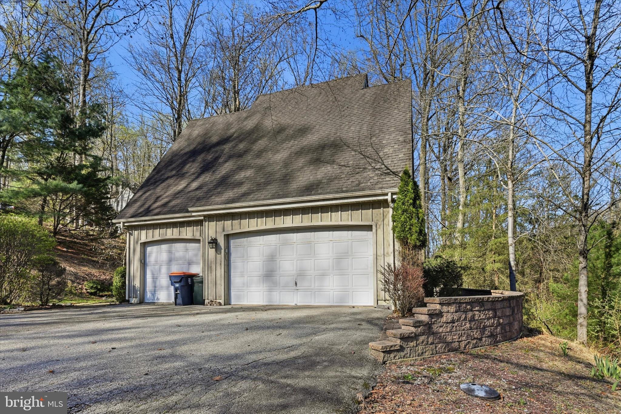 2 Timber Mill Lane Landenberg, PA 19350 - Photo 31 of 32 a front view of a house with a yard and garage
