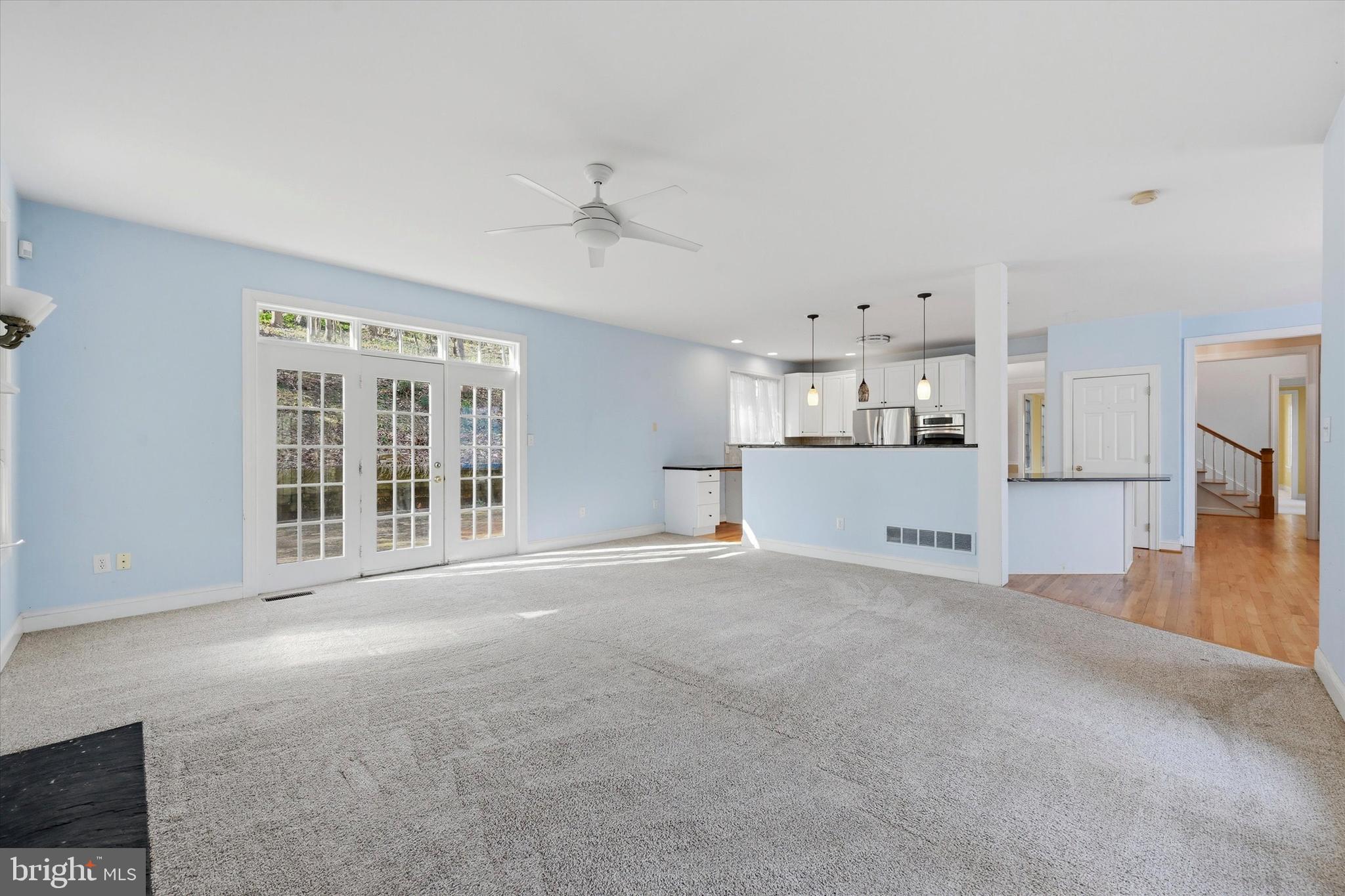 2 Timber Mill Lane Landenberg, PA 19350 - Photo 10 of 32 a view of a big room with windows and chandelier fan