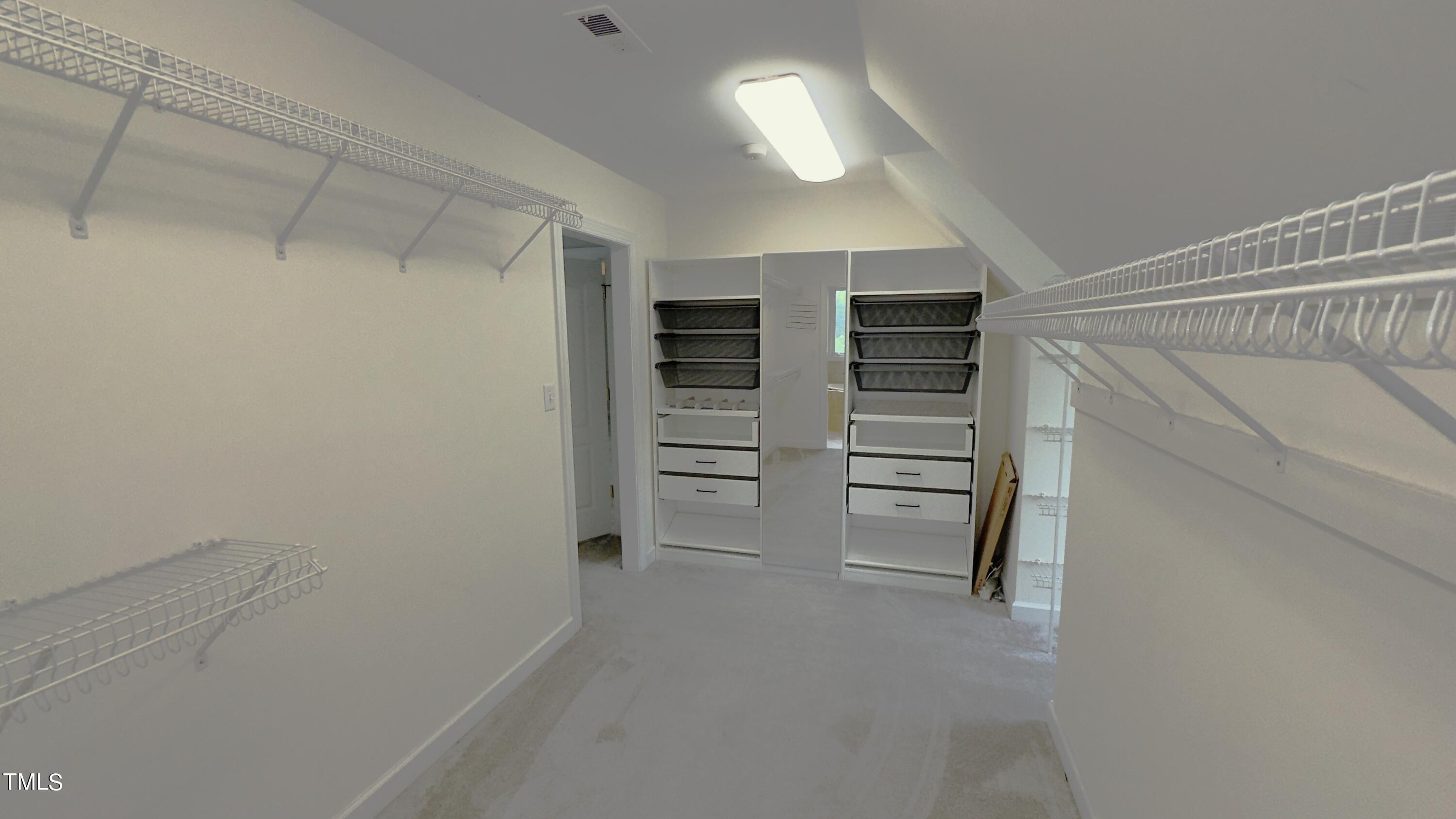 1911 South Mineral Springs Road Durham, NC 27703 - Photo 14 of 31 a view of an empty walk in closet