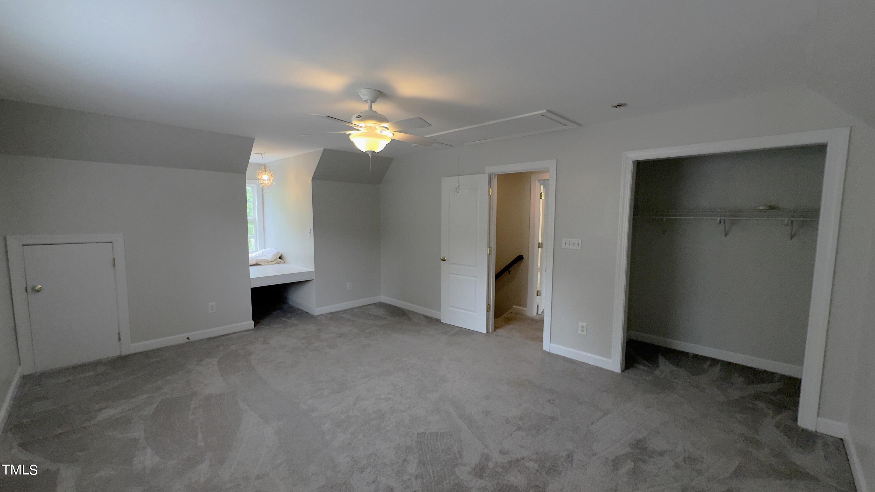 1911 South Mineral Springs Road Durham, NC 27703 - Photo 17 of 31 an empty room with closet and fan