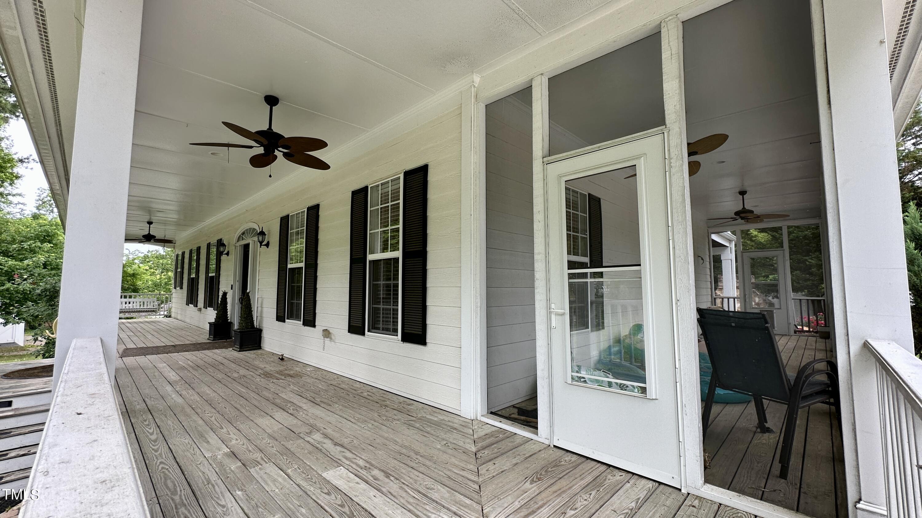 1911 South Mineral Springs Road Durham, NC 27703 - Photo 2 of 31 a view of a porch with wooden floor and a floor to ceiling window