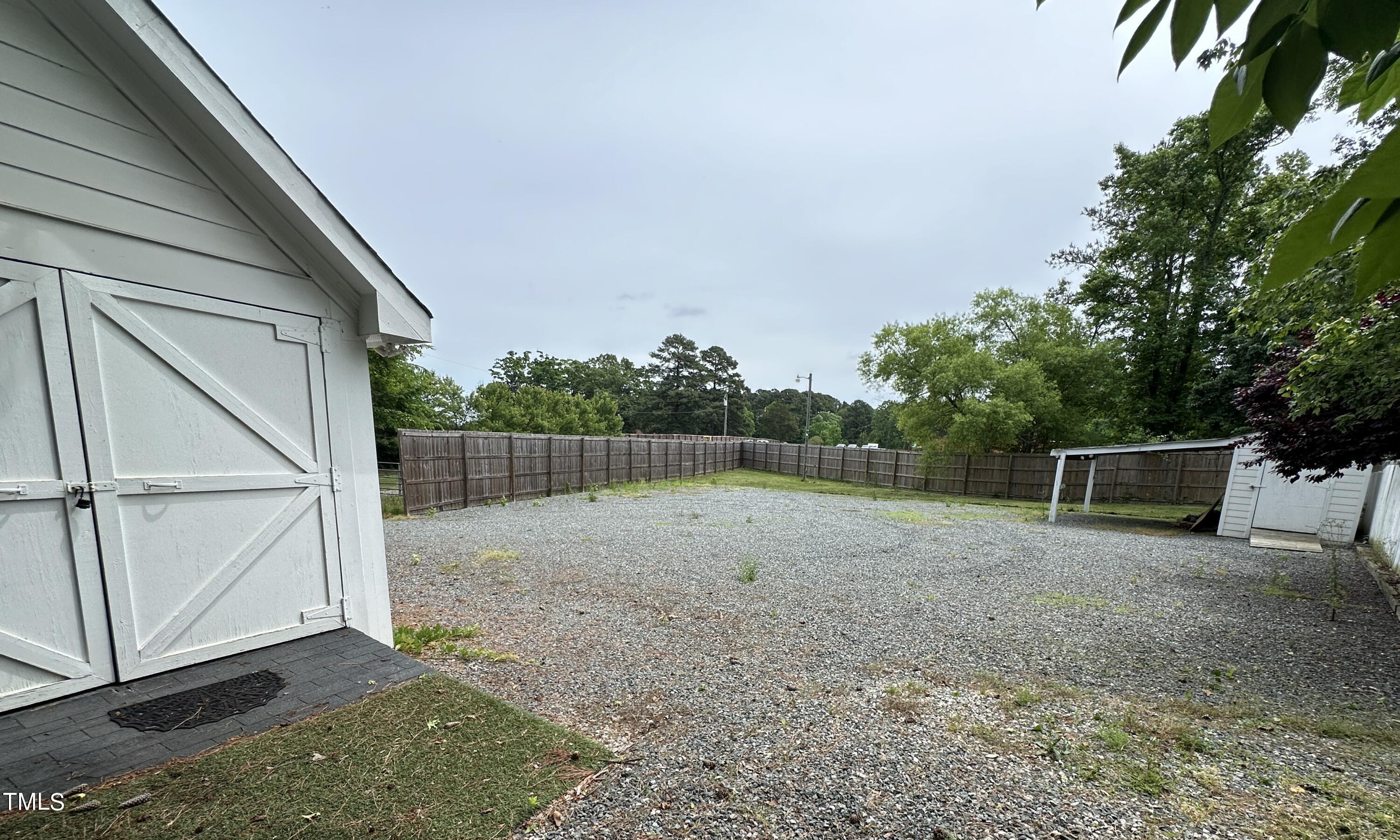 1911 South Mineral Springs Road Durham, NC 27703 - Photo 23 of 31 a backyard of a house with lots of green space