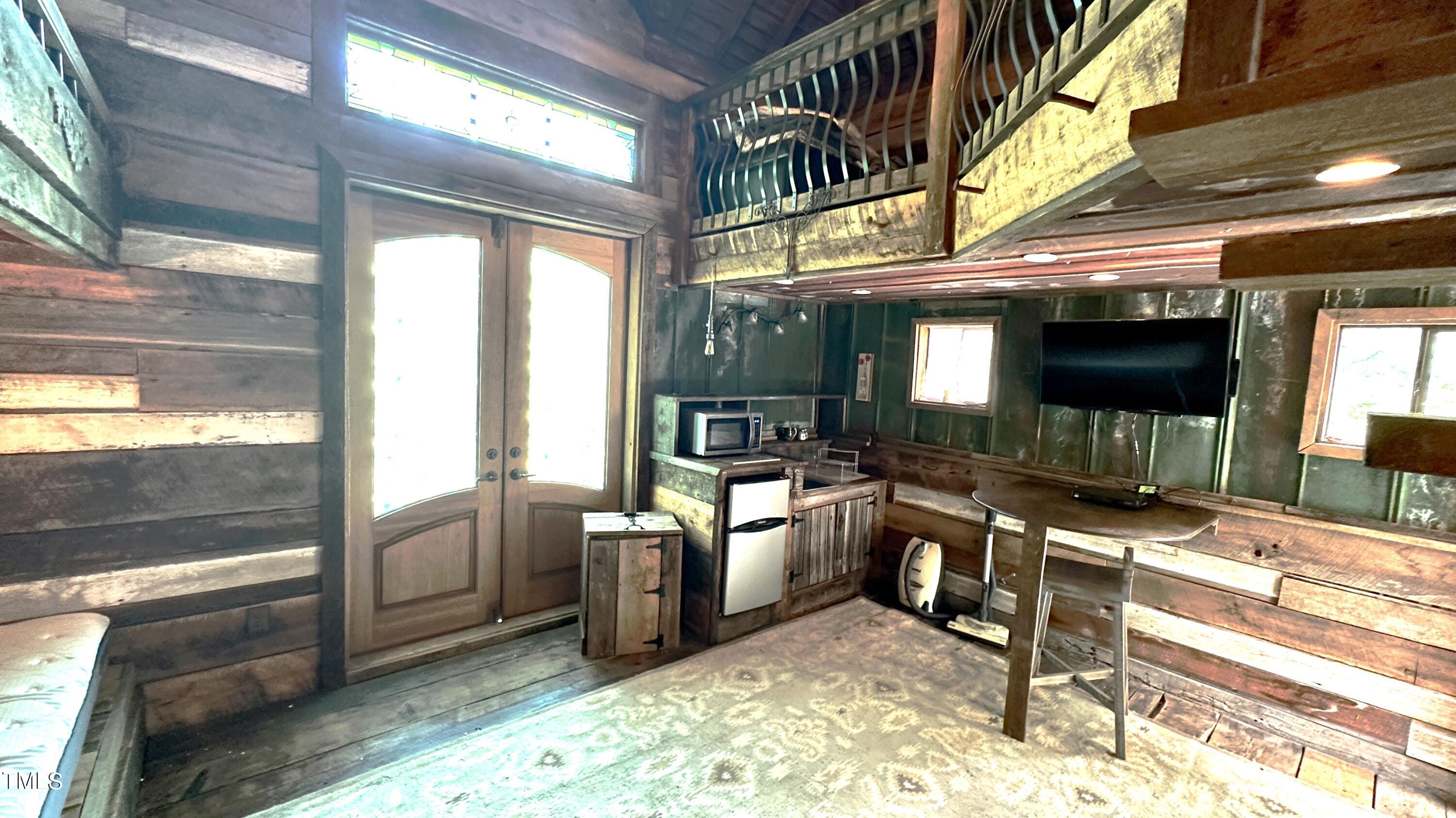 1911 South Mineral Springs Road Durham, NC 27703 - Photo 26 of 31 a lobby with furniture and flat screen tv