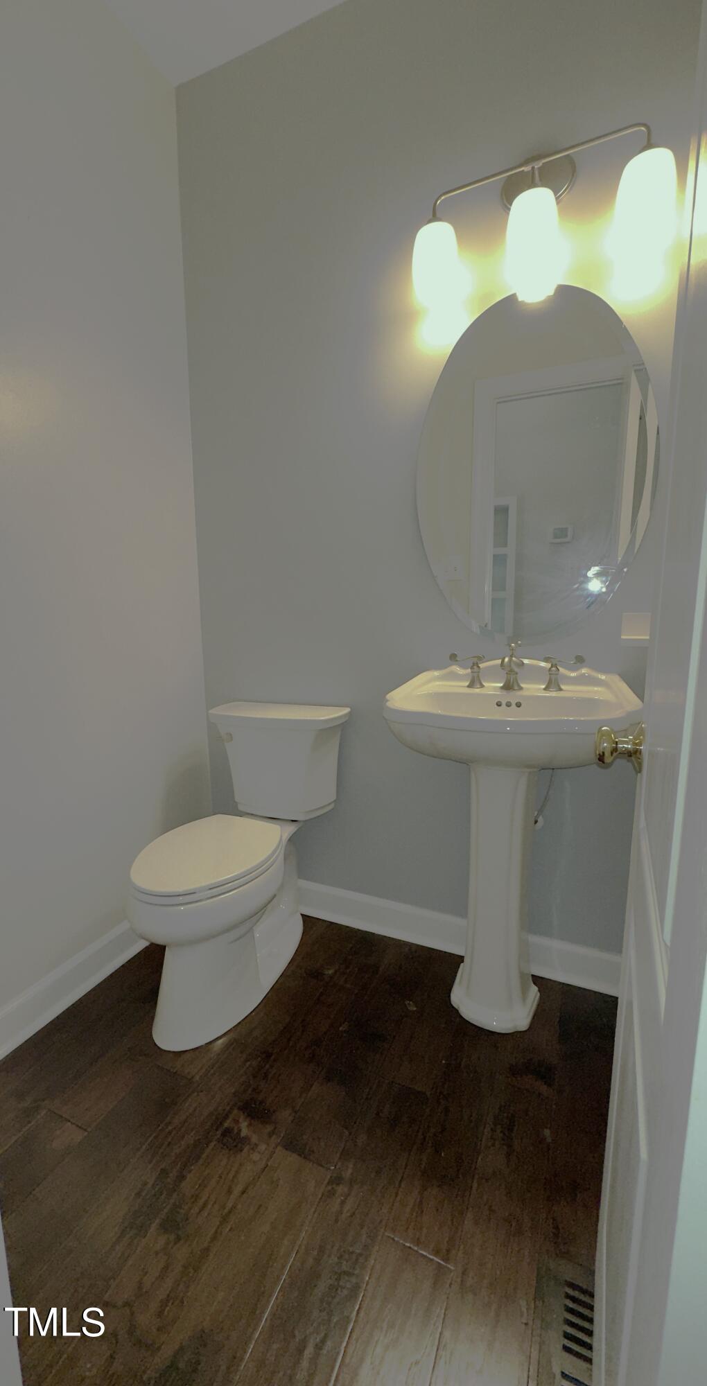 1911 South Mineral Springs Road Durham, NC 27703 - Photo 5 of 31 a white toilet sitting next to a white sink