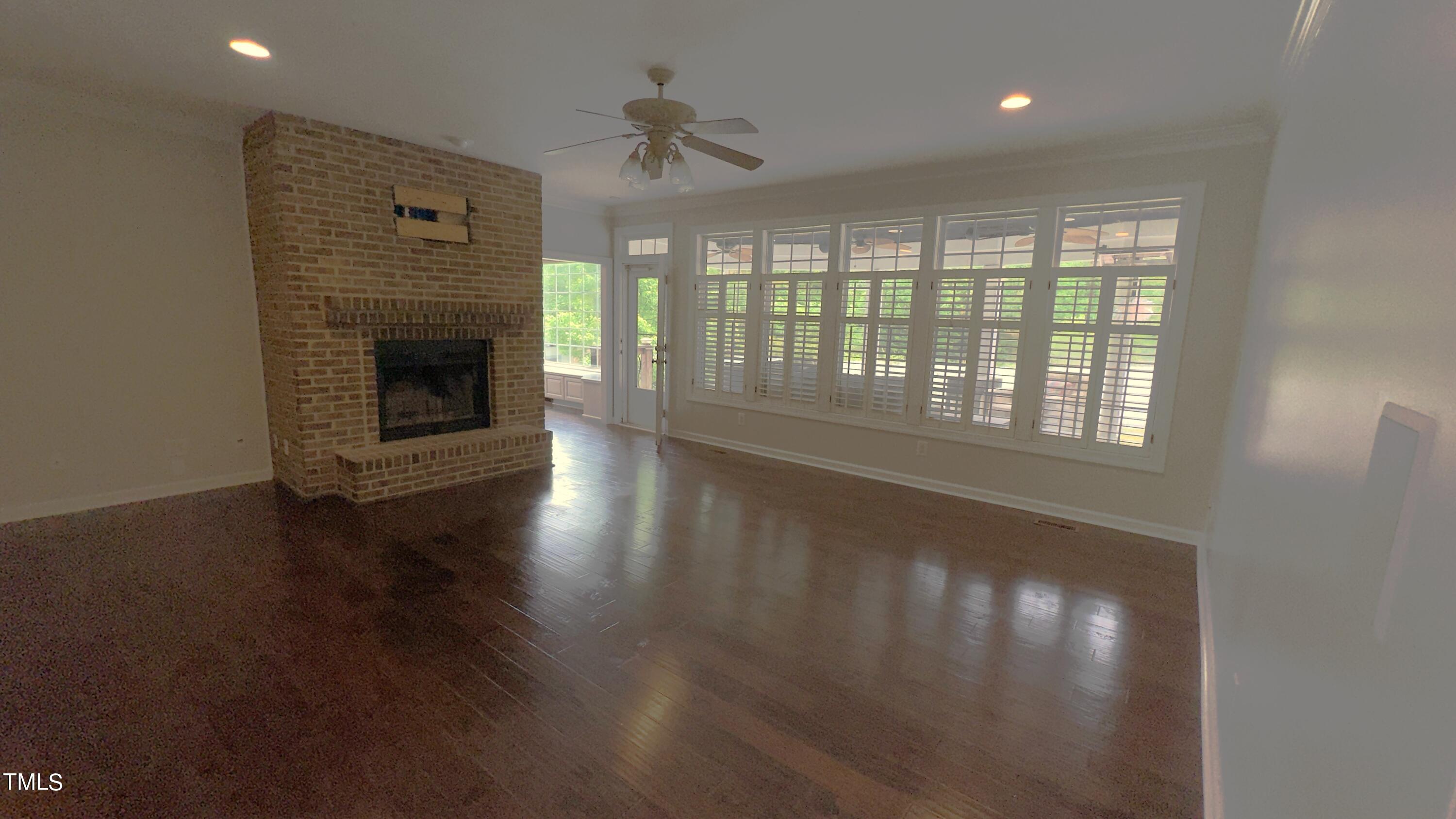 1911 South Mineral Springs Road Durham, NC 27703 - Photo 6 of 31 a view of an empty room with wooden floor and a window