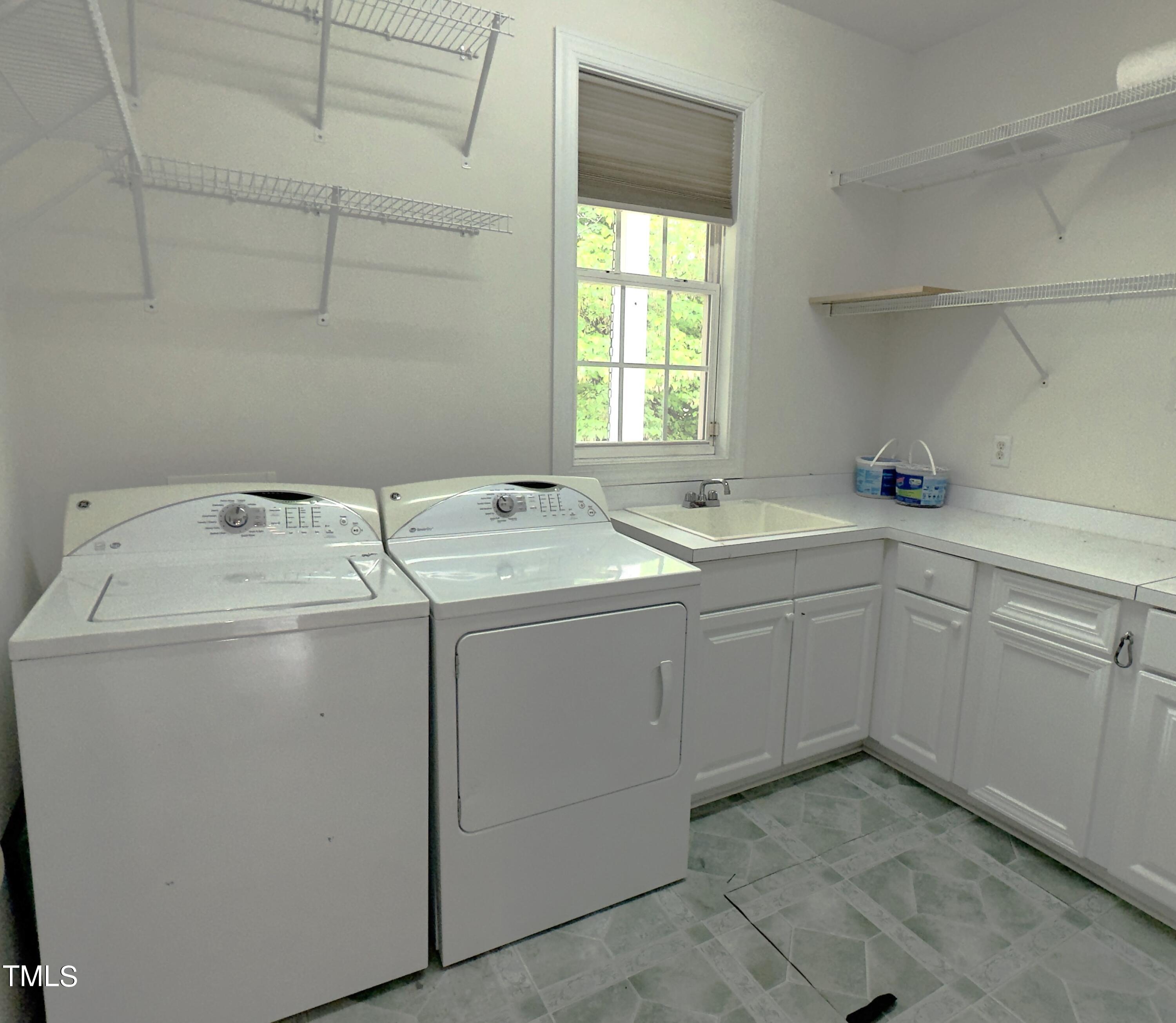 1911 South Mineral Springs Road Durham, NC 27703 - Photo 9 of 31 a utility room with dryer and washer