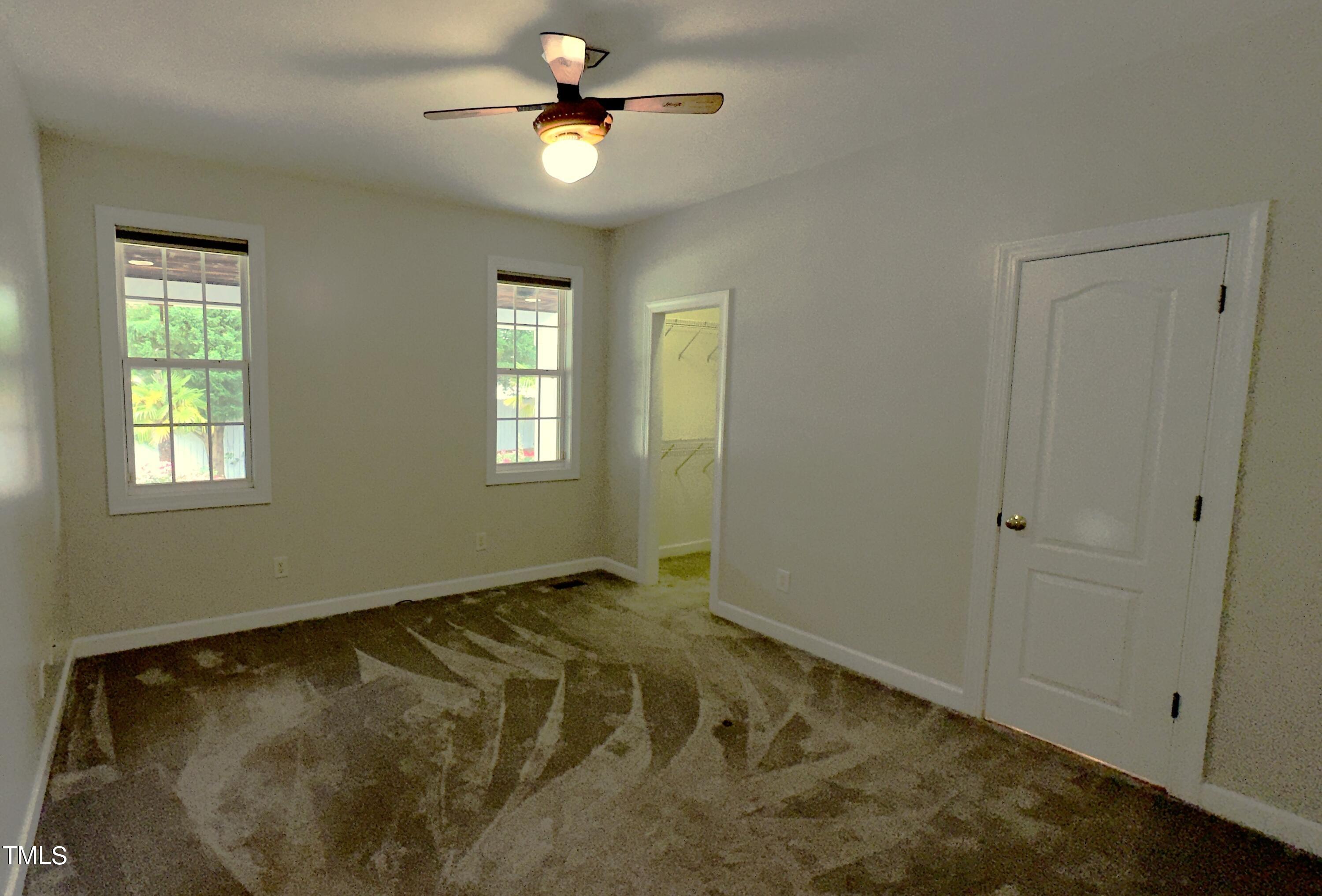 1911 South Mineral Springs Road Durham, NC 27703 - Photo 10 of 31 a view of room with a ceiling fan and window