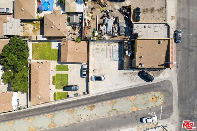 an aerial view of residential house with outdoor space and swimming pool