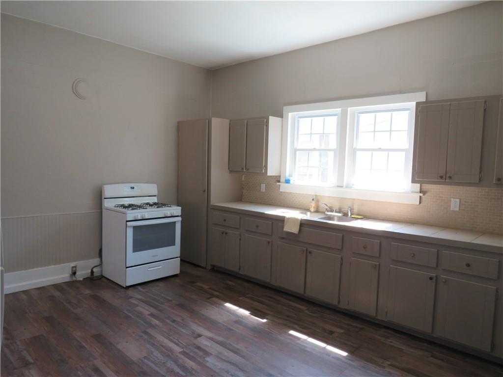 293 4th Street Cedartown, GA 30125 - Photo 12 of 15 a kitchen with sink a microwave and cabinets