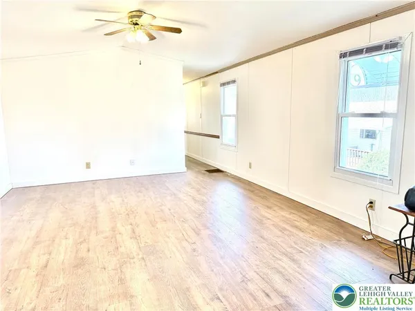 a view of gallery with wooden floor