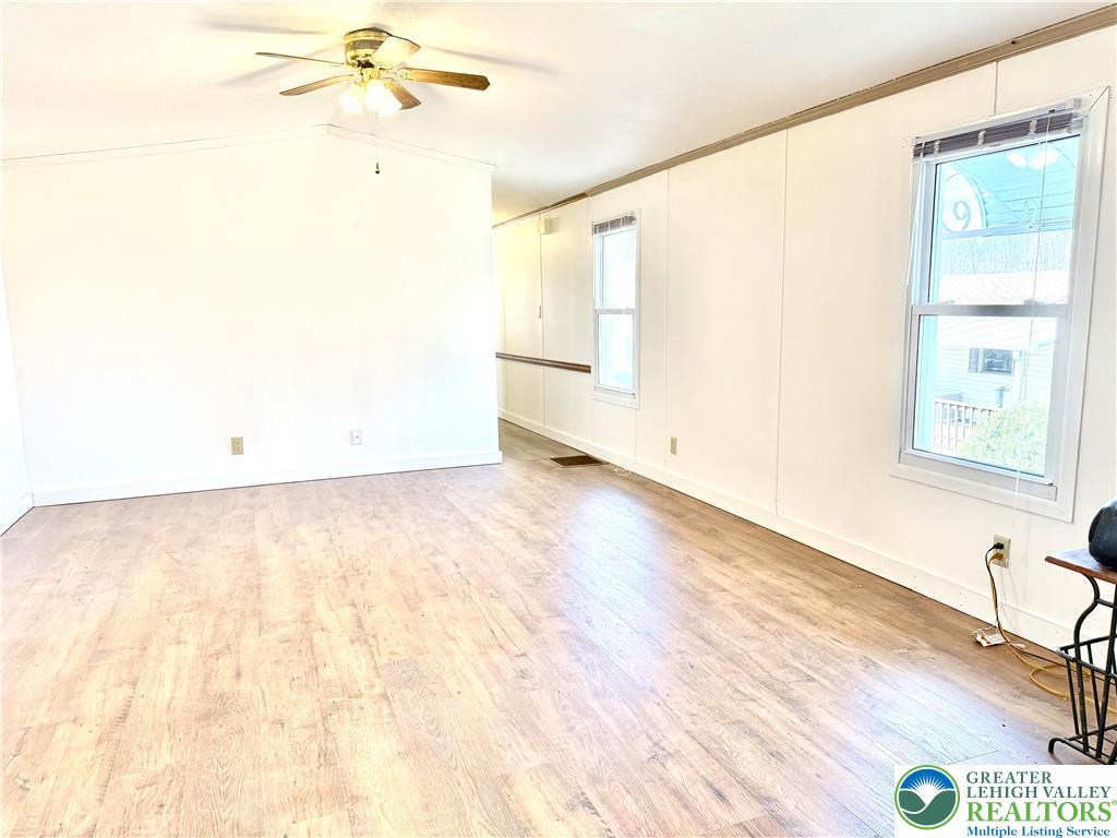 204 Molly Pitcher Road Mount Bethel, PA 18343 - Photo 14 of 34 a view of an empty room with wooden floor and a window