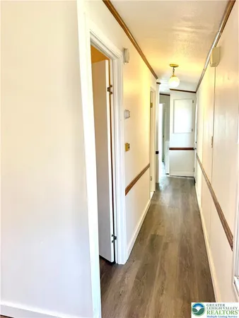 a view of a small space with wooden floor