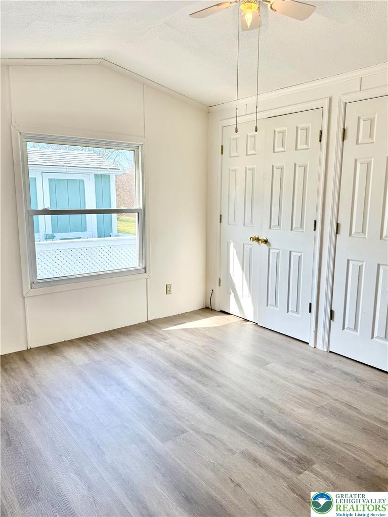 204 Molly Pitcher Road Mount Bethel, PA 18343 - Photo 20 of 34 a view of empty room with wooden floor and fan