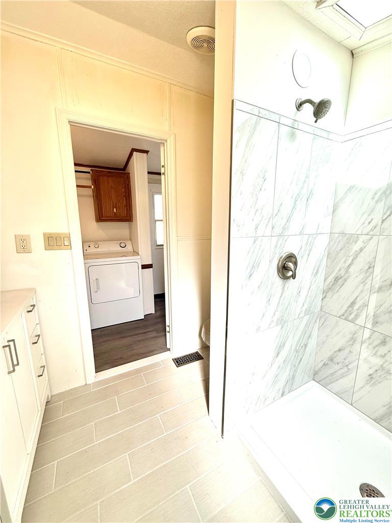 204 Molly Pitcher Road Mount Bethel, PA 18343 - Photo 25 of 34 a bathroom with a tub sink and shower