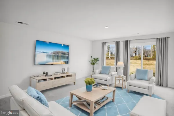 a living room with furniture and a table