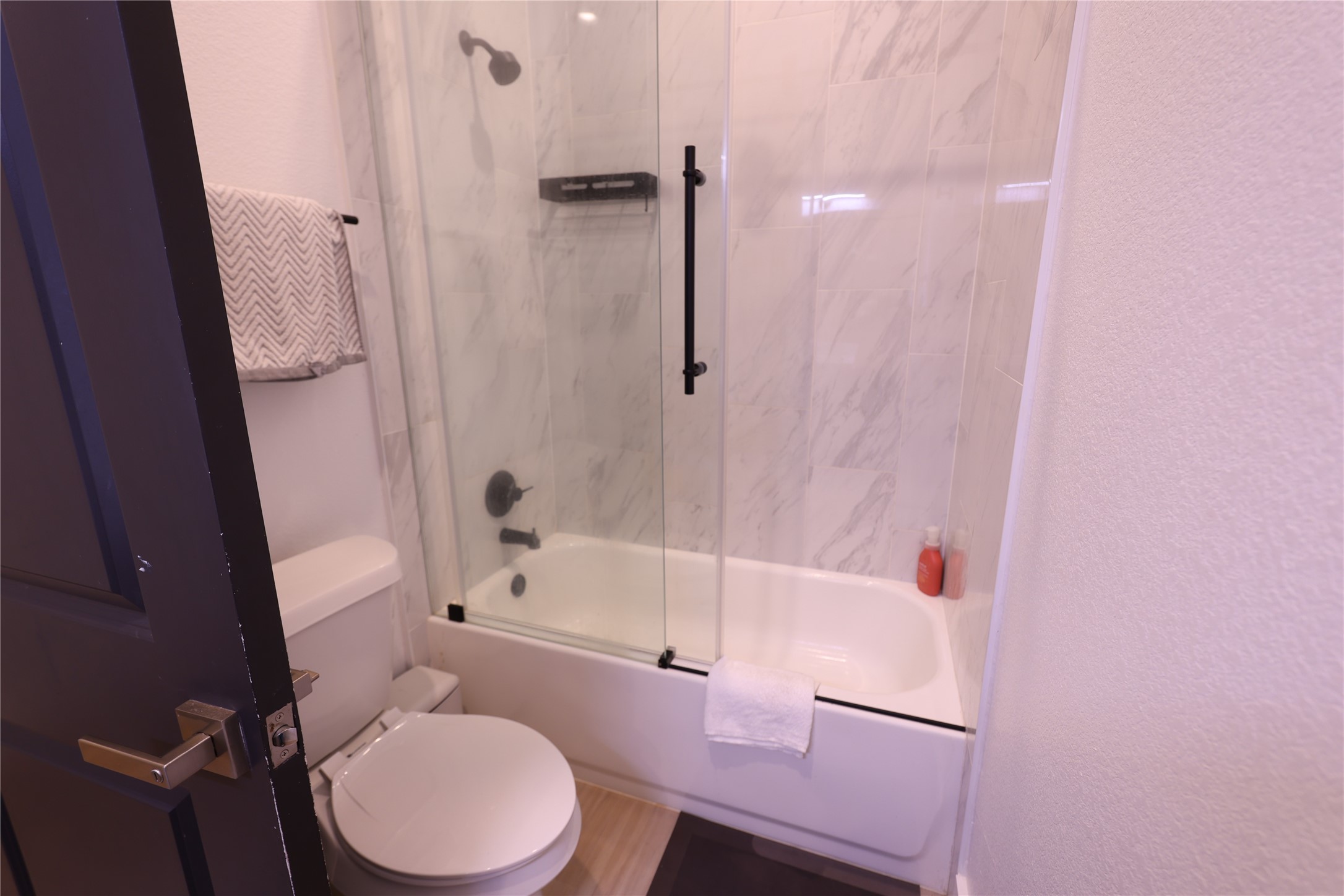 3549 Amos Street Houston, TX 77021 - Photo 12 of 19 a white toilet sitting next to a bath tub