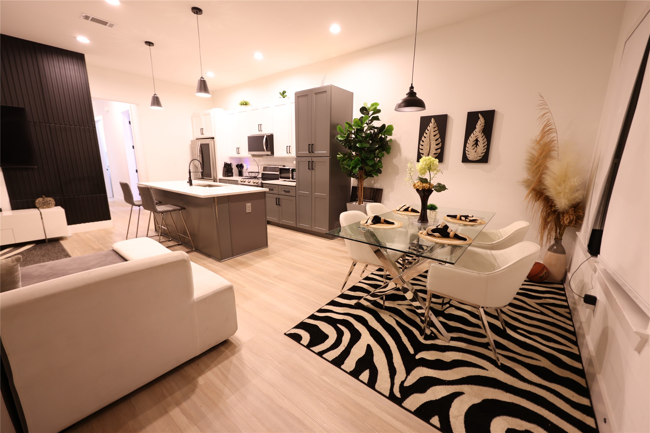 3549 Amos Street Houston, TX 77021 - Photo 3 of 19 a kitchen with stainless steel appliances kitchen island granite countertop a sink and a refrigerator
