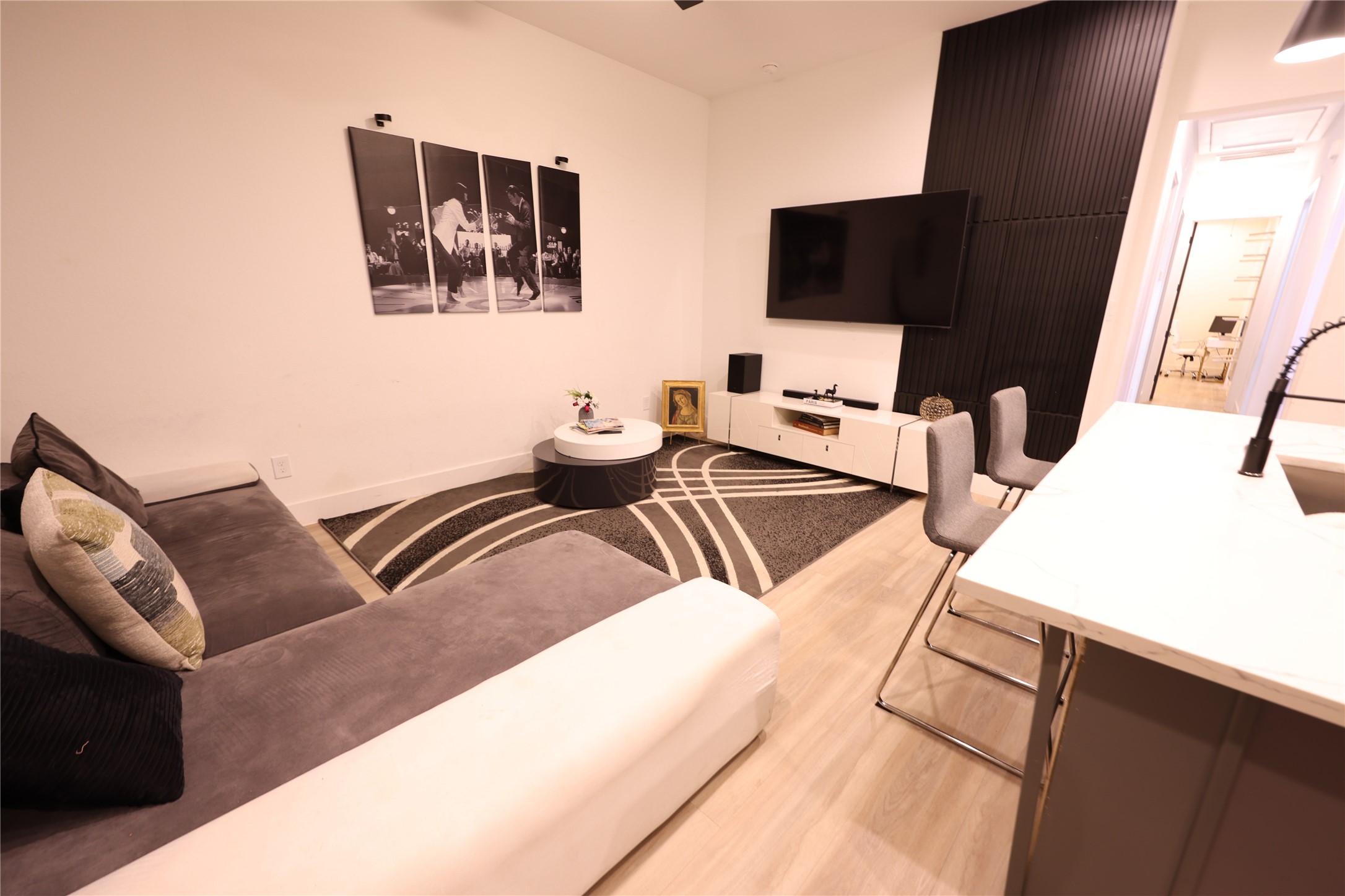 3549 Amos Street Houston, TX 77021 - Photo 4 of 19 a living room with couches and flat screen tv