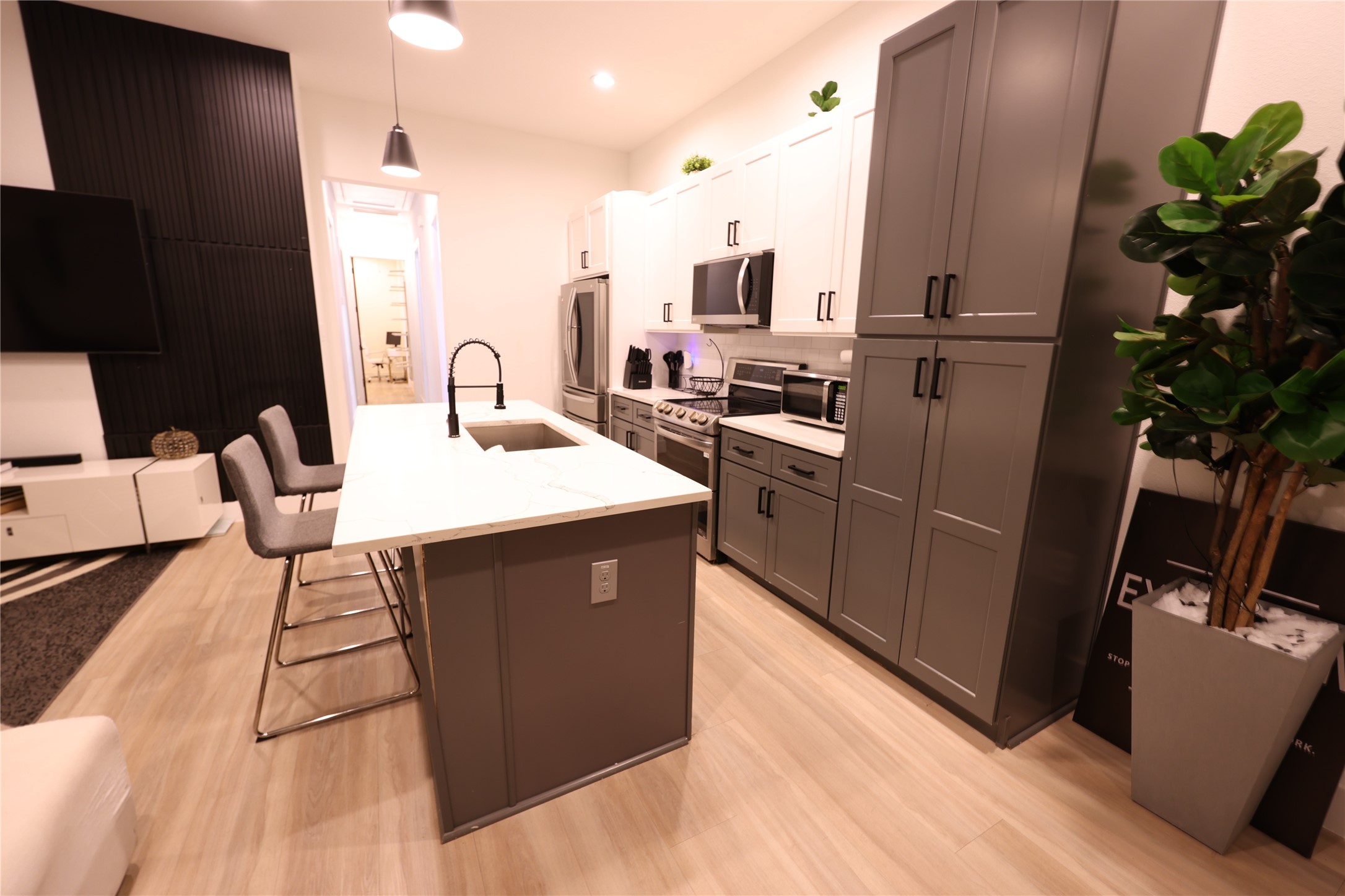 3549 Amos Street Houston, TX 77021 - Photo 8 of 19 a kitchen with stainless steel appliances granite countertop a refrigerator a sink dishwasher a stove with wooden floor