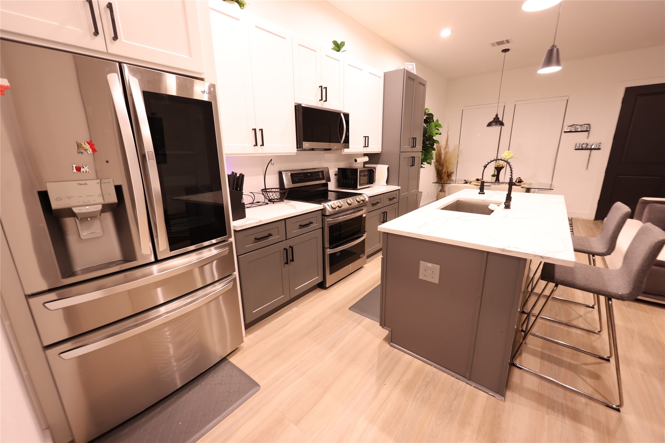 3549 Amos Street Houston, TX 77021 - Photo 10 of 19 a kitchen with stainless steel appliances granite countertop a refrigerator stove and sink