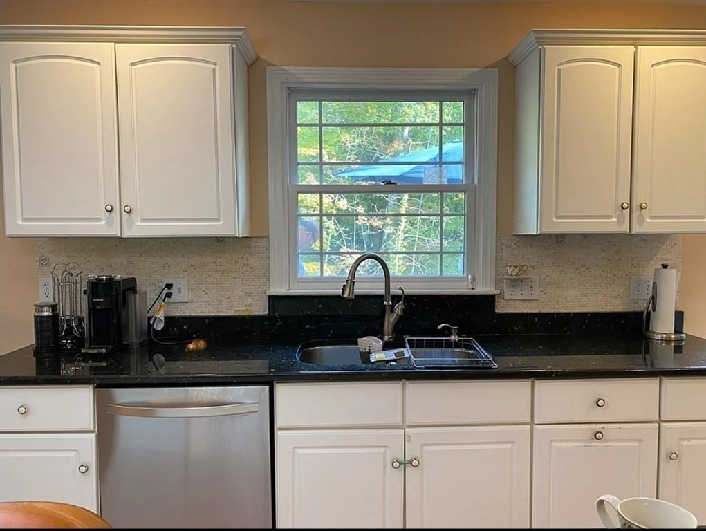 338 River Road Andover, MA 01810 - Photo 12 of 28 a kitchen with granite countertop white cabinets and window