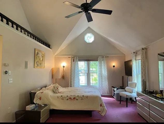 a living room with furniture and flat screen tv