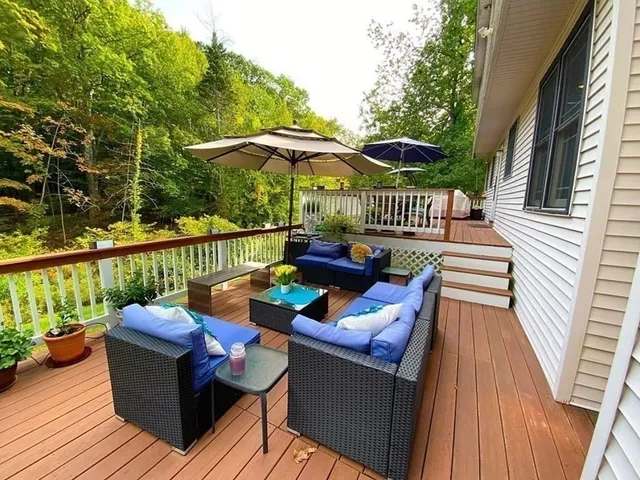swimming pool view with a seating space