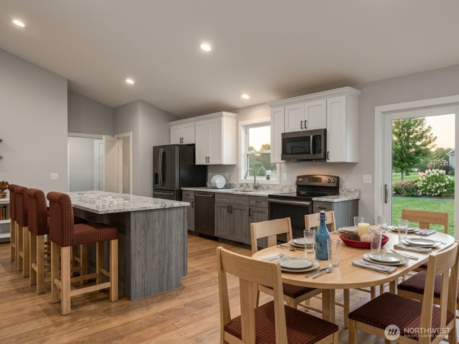 4 Endor Heights Vader, WA 98593 - Photo 8 of 15 a kitchen with a table chairs microwave and cabinets