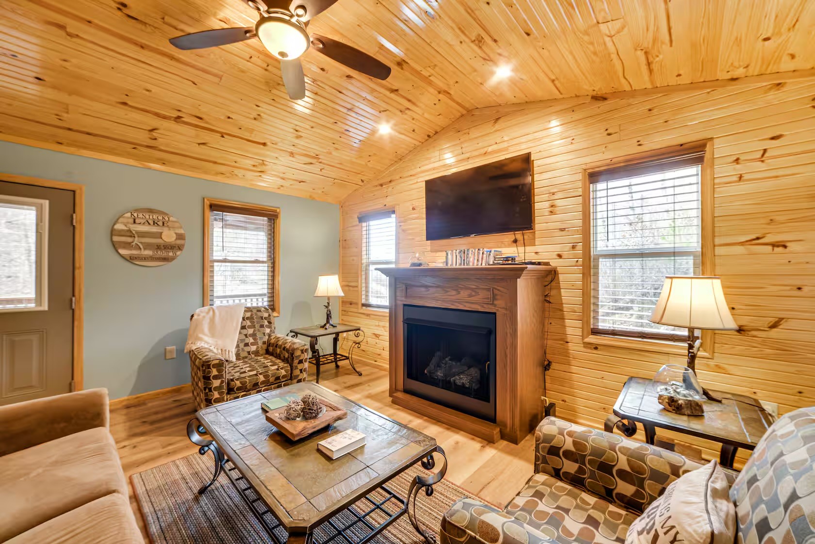 3000 Highwater Road Waverly, TN 37185 - Photo 5 of 26 a living room with furniture a fireplace and a flat screen tv
