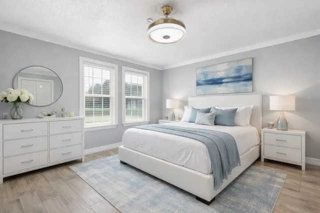 a bedroom with a bed and window