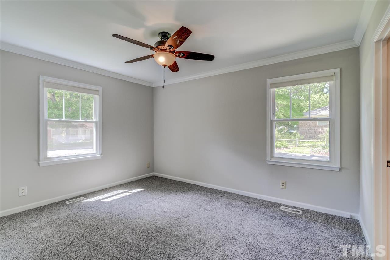 5907 Newhall Road Durham, NC 27713 - Photo 14 of 29 a view of an empty room with a window